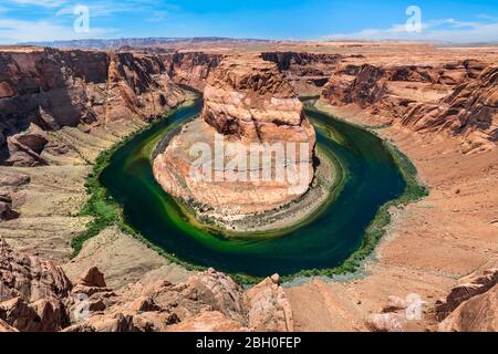 Wide angle view of the Horseshoe Bend, Page, Arizona as seen from the viewpoint in a sunny summer day Stock Photo