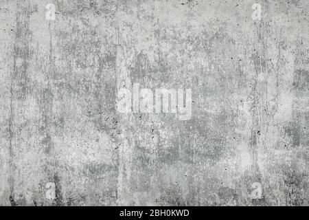 Gray concrete surface with cracks. An image of a cemented surface with a grunge, dirty stain, as an idea for making a background. Stock Photo