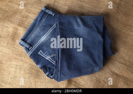 A pile of ripped jeans. Textile, denim 