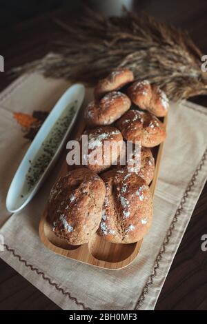 Fresh homemade breads with some decorations on the table. Stock Photo