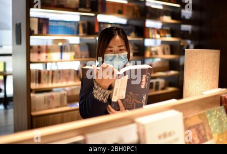 Hengshui, China's Hebei Province. 23rd Apr, 2020. A woman reads at a library in Taocheng District of Hengshui, north China's Hebei Province, April 23, 2020. World Book and Copyright Day falls on April 23 yearly to promote reading, publishing and copyright. Credit: Zhu Xudong/Xinhua/Alamy Live News Stock Photo
