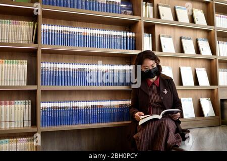 Hengshui, China's Hebei Province. 23rd Apr, 2020. A woman reads at a library in Taocheng District of Hengshui, north China's Hebei Province, April 23, 2020. World Book and Copyright Day falls on April 23 yearly to promote reading, publishing and copyright. Credit: Zhu Xudong/Xinhua/Alamy Live News Stock Photo
