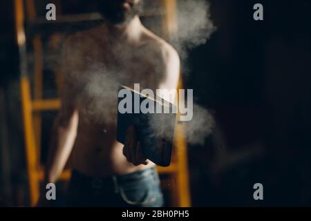 Man holds burning book in his hands. Stock Photo