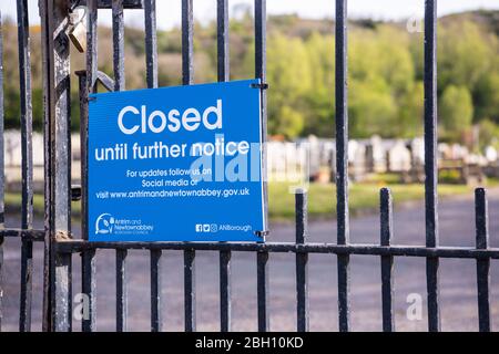 Northern Ireland, UK. 24 April 2020 - Sign outside a cemetery advising the public that it is closed due to Covid-19.   Health Minister Robin Swann is under public and legal pressure to reopen cemeteries in Northern Ireland which have been forced to close to visitors, with the exception of funerals, due to Covid-19.  Relatives are upset that they are unable to visit graves of recently deceased people. Credit: Stephen Barnes/Alamy Live News Stock Photo