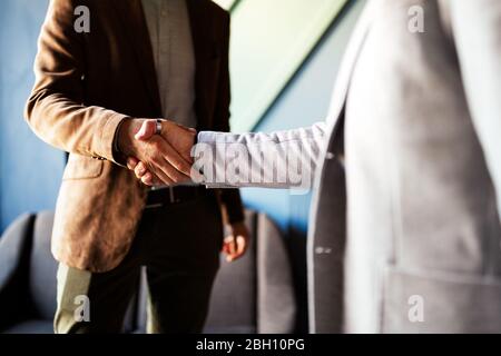 Business handshake and business people concept. Partnership, deal, agreement. Stock Photo