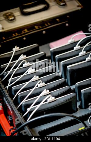 A case of Apple iPad Air tablets on charge. Stock Photo