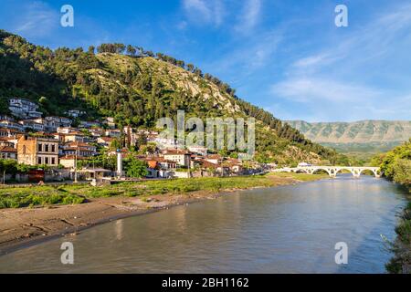 Old bridge over the Osumi River and traditional houses in Berat, Albania Stock Photo