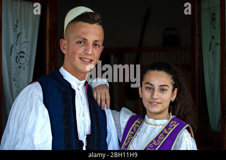 Young Albanian couple in national costumes, in Berat, Albania. Stock Photo