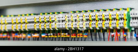 Color wires in a box of distribution of an electricity. Stock Photo