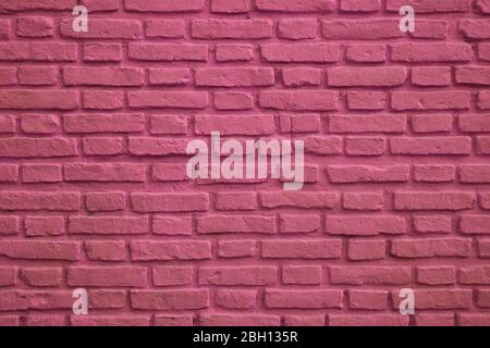 Front View of Magenta Colored Old Brick Wall for Background or Banner Stock Photo