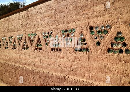 Adobe outer wall with unique decoration in a desert town of San Pedro de Atacama, northern Chile Stock Photo