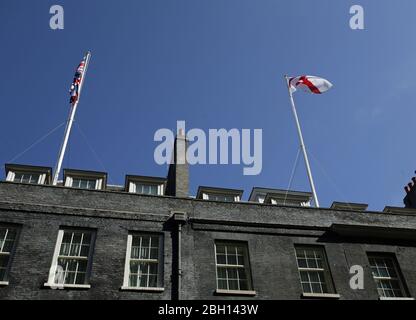 The Union flag and a flag with the cross of St George flying above Downing Street, London, to mark St George's Day. Stock Photo