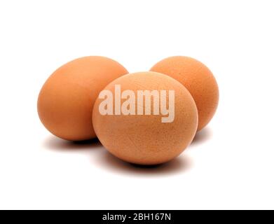 Three chicken eggs on a white background largly Stock Photo