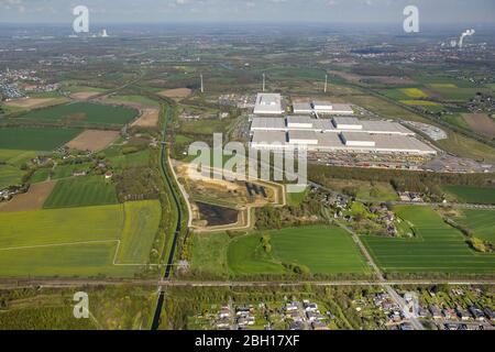 Construction site with development works and embankments works a rainwater retention basin in Dortmund-Mengede, IKEA Distribution Services, 18.04.2016, aerial view, Germany, North Rhine-Westphalia, Ruhr Area, Dortmund