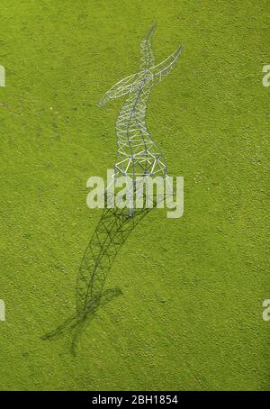 , Zauberlehrling, high steel sculpture, reminiscent of a dancing power pole in Oberhausen, 20.04.2016, aerial view, Germany, North Rhine-Westphalia, Ruhr Area, Oberhausen Stock Photo