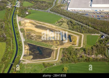 Construction site with development works and embankments works a rainwater retention basin in Dortmund-Mengede, 18.04.2016, aerial view, Germany, North Rhine-Westphalia, Ruhr Area, Dortmund Stock Photo