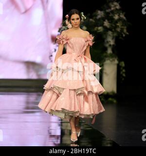 SEVILLA, SPAIN - JAN 30: Model wearing a dress from the Preludio collection by designer Luis Fernandez as part of the SIMOF 2020 (Photo credit: Mickael Chavet) Stock Photo