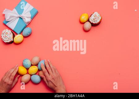 multi-colored eggs for the Easter holiday on a pink background Stock Photo