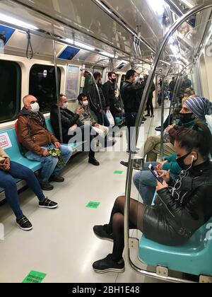 TURKEY, ISTANBUL - April 22, 2020 . people in medical masks in metro subway. social distancing in public transportation. Stock Photo