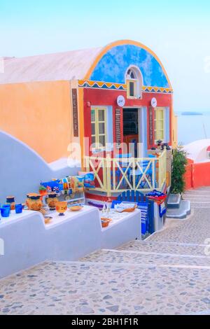 Santorini, Greece - April 26, 2019: Typical and amazing colorful street view and cafe in Oia town Stock Photo
