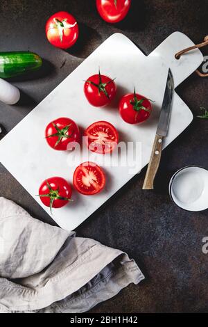 Cherry tomatoes on a white marble tray. Stock Photo