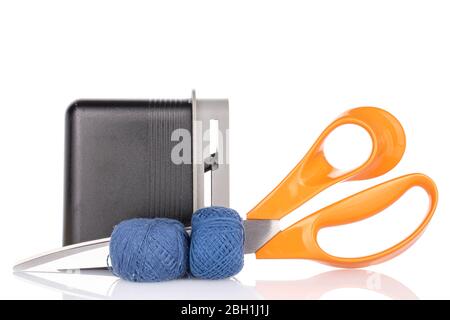Group of two whole thread spools with scissors and sharpener isolated on white Stock Photo