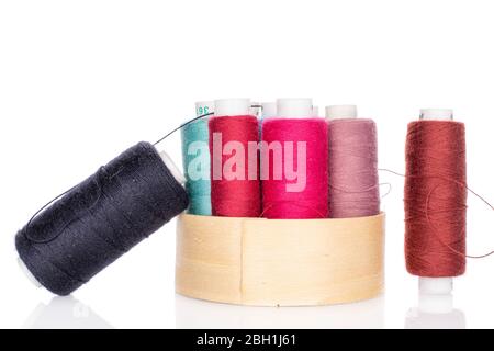 Lot of whole thread spools in bamboo isolated on white Stock Photo