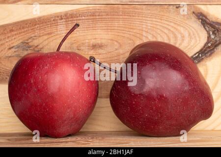 Group of two whole red delicious apple on wood Stock Photo