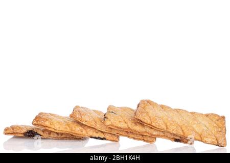 Lot of whole square puff cookie with raisins in row isolated on white Stock Photo