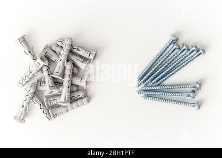 Dowels and fasteners screws isolated on white background Stock Photo