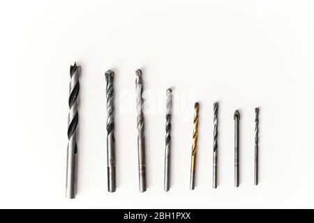 Drill bits for wood and concrete of different sizes isolated. Stock Photo