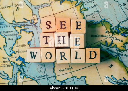 See the world written in wooden blocks on a vintage travel map Stock Photo