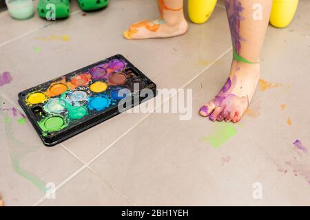 Little girl painting with watercolors Stock Photo