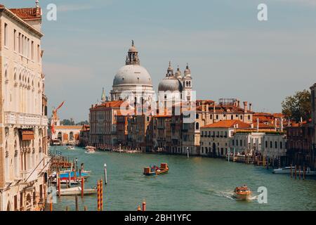 Old cathedral of Santa Maria della Salute and Grand Canal in Venice, Italy Stock Photo