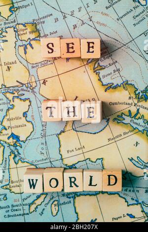 See the world written in wooden blocks on a vintage travel map Stock Photo