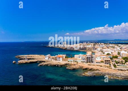 Spain, Balearic Islands, Colonia de Sant Jordi, Aerial view of town along shore of Cala Galiota bay in summer Stock Photo