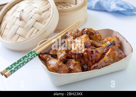 asian style hot chicken wings served on bowl Stock Photo