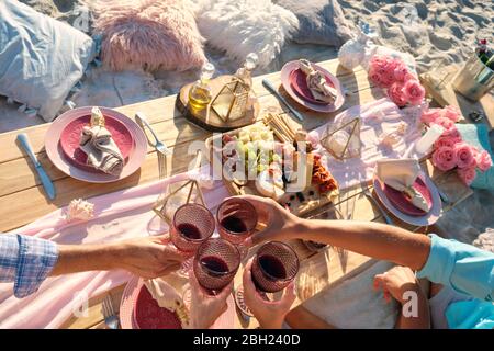Luxury beach picnic close up with multiple people and a delicious set of food and wine. Riviera Nayarit, Mexico Stock Photo