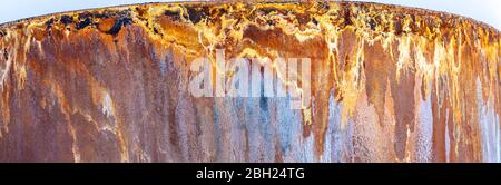 Beautiful rust pattern on the side of a metal storage tank. Corrosion caused by acidic water from Bjarnarflag Geothermal Power Station, near Krafla vo Stock Photo