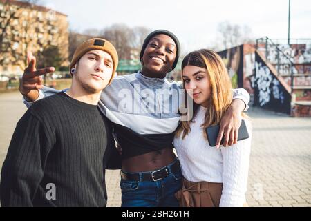 Friends having fun in a skate park Stock Photo