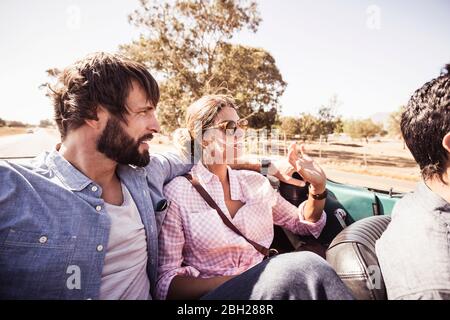 Couple in convertible car on a road trip Stock Photo