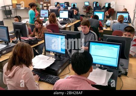 Brownsville, Texas USA, December 2005: Computer lab at Hanna High School, students working on class projects. 98% of the school's students are Hispanic. ©Bob Daemmrich Stock Photo