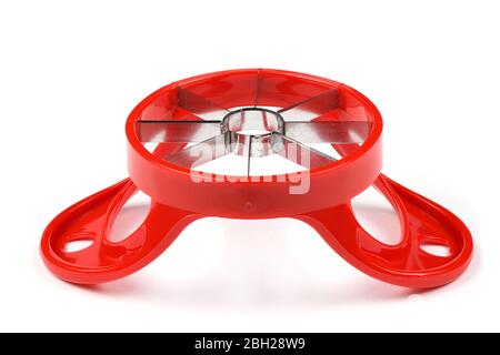 Red device for slicing apples isolated on white background. High resolution photo. Full depth of field. Stock Photo