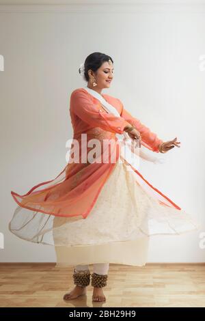 Beautiful kathak dancer performing at home. Stock Photo