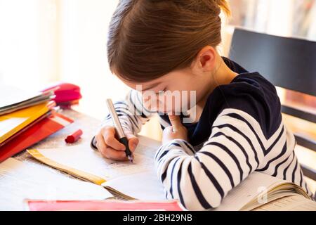 Girl doing homework Stock Photo