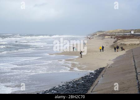 Stormy North sea and people at the beach in winter, Sylt, North Frisian Island, North Frisia, Schleswig-Holstein, Germany, Europe Stock Photo