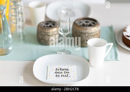 Laid coffee table with napkin printed  with saying Stock Photo