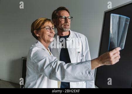 Two doctors discussing x-ray image Stock Photo