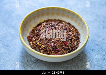 Winter Berry Dried Rooibos Tea Pieces with Dry Strawberry, Hibiscus, Flavoring, Cinnamon, Cloves, Rosehip, Apple, Calendula, Vanilla bits. Ready to Us Stock Photo