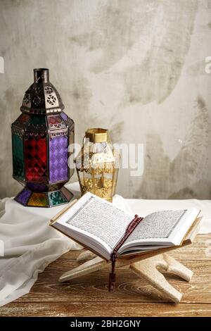 holy quran and arabic lantern for eid mubarak background Stock Photo